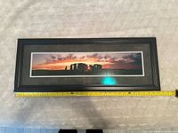 Full view panoramic Stonehenge photo in frame with measuring tape showing width