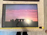 Framed Stonehenge poster with measuring tape for scale