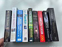 Spine view of all nine paperback novels