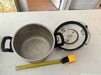 Pot body, detached lid, tape for diameter reference