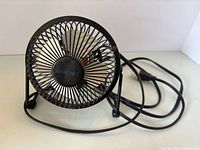 Front view of small metal desk fan
