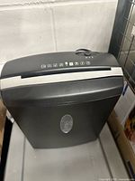 Overall view of black and silver paper shredder