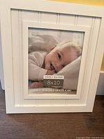 Front view of white 8x10 Studio Decor frame with placeholder image