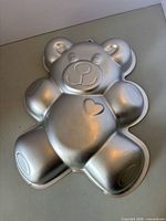 Front exterior of teddy bear cake pan showing overall shape and condition