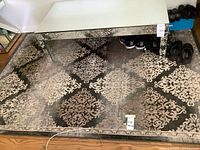 Full view of rug under table showing overall size and pattern