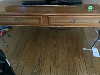 Full view of coffee table showing drawers and legs