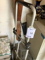 Full view of folding hand truck showing frame, handle and wheels