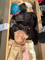 Drawer view with multiple bras, panties visible