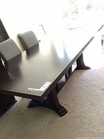 Full view of dark solid wood dining table top
