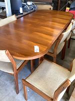 Overall view of teak dining table with six chairs