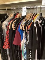 Rack of assorted designer garments on hangers