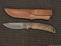 Leupold knife in leather sheath, showing entire knife and sheath