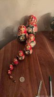 Full set of nesting dolls arranged largest to smallest