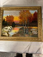 Full view of framed landscape painting