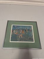 Full view of framed Raoul Dufy Sailboats print with green mat and silver frame