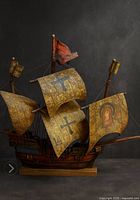 Full port-side view of wooden Santa Maria model with sails and rigging