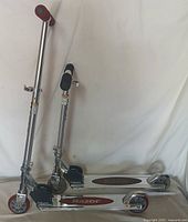 Both Razor scooters standing unfolded