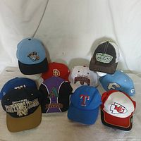 Group shot of all ten caps arranged together