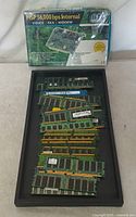 Sealed BTC HSP 56K modem box and tray of assorted RAM modules