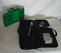 Overall view showing Plano tackle box and Plusinno kit open with rod, reel, small tackle box