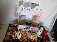 Group shot of floral box filled with Ty Beanie Baby and Beanie Boo plush toys, front row displayed
