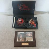 CD collector set opened showing disc and card panel