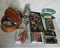 Overall lot view showing all sewing accessories