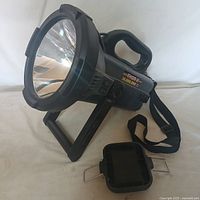 Full view of Thor-X spotlight with stand and accessory