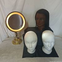 Full lot showing mirror and three mannequin heads