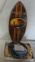 Zen garden kit in box with surfboard decor behind