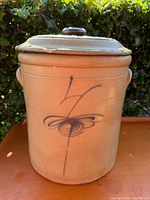 Full view of crock with lid and decoration