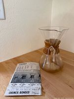 Chemex coffee maker with pamphlet on countertop