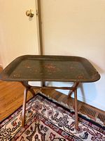 Full view of assembled tray table showing tray and folding stand