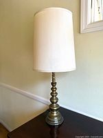 Entire lamp with shade on table