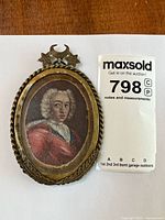 Front view showing painting, frame, and auction tag