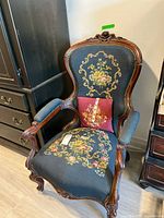 Front view of armchair with pillow showing overall design