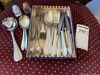 Box of assorted silver-plated flatware, two serving spoons, salt and pepper shakers