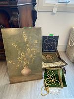 Lot overview showing floral print, stained glass panel and textile pieces