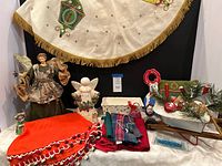 Group shot showing both tree skirts, angels, baking dish, textiles, figurines and plaque