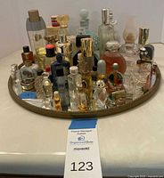 Full view of tray showing assortment of perfume bottles