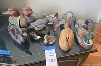 All twelve bird figures and bookends displayed on tabletop