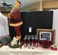 Full lot showing carved Santa, pillow, glasses, bowl, print, figurines
