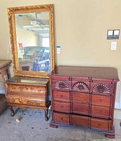 Group shot showing mirror, bombe chest and carved dresser