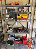 Full view of shelving showing all tools, cords, organizers and toolboxes