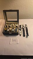 Overall lot showing watch case and extra watches
