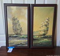 Front view of both framed paintings side by side