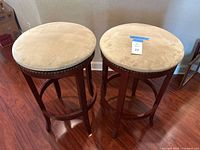 Both bar stools showing full view, seats and frames