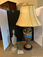 Cut-crystal brass lamp left, ornate urn lamp with shade right, full view