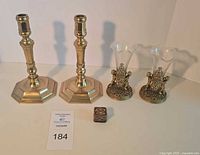 Group shot showing all five items: two candlesticks, two bud vases with glass, one trinket box