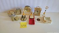 All 11 gold-tone clocks and decorative items